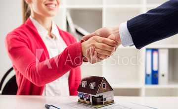 Adobe stock photo of man shaking a woman's hand